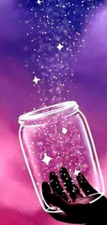 Hand holds cosmic jar with stars against pink and purple backdrop.