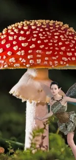 Fairy with wings beside a red mushroom.