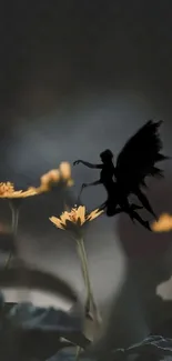 Silhouette of fairy with yellow flowers on dark background.