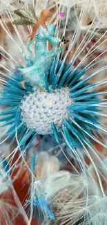 A fairy delicately sits atop a dandelion in a blue-hued, magical wallpaper.