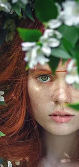 Red-haired portrait with white flowers and green leaves.