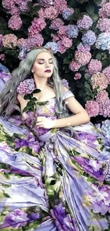 Woman in purple floral dress lying in hydrangea flowers.