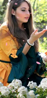 Woman in yellow dress amidst garden flowers.