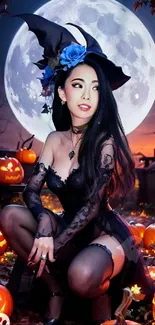 Halloween witch with pumpkins and full moon at night.