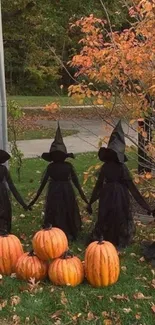 Whimsical witches holding hands near pumpkins in an autumn setting.