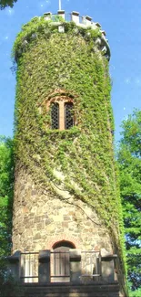 Ivy-covered stone tower surrounded by lush greenery and trees.