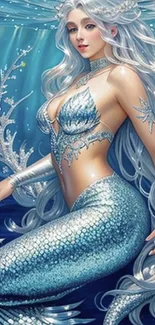 Enchanting blue mermaid with silver hair in underwater scene.