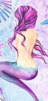 Colorful mermaid fantasy wallpaper with purple hues.