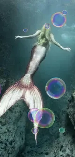 Mermaid swimming gracefully in deep ocean waters.