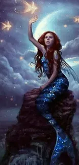 Mermaid on rock under moonlit night sky.