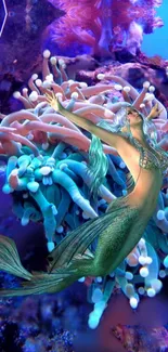 Mermaid amidst vibrant coral and marine life underwater.