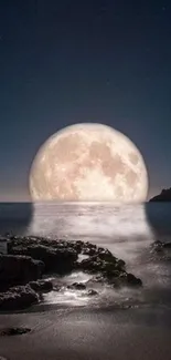 Moon rising over calm ocean at night.