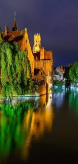 Illuminated historic buildings reflecting on a canal at night, creating a tranquil view.