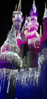 Enchanting castle with twinkling lights against a night sky in pink and blue hues.