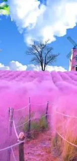 Pink field with windmill and heart-shaped cloud against vibrant sky.