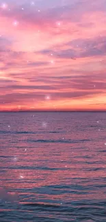 Enchanting pink ocean sunset with serene sea and sparkling stars.