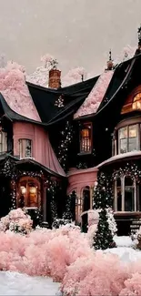 Pink house in snow with winter trees, creating a whimsical, enchanting scene.