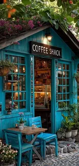Rustic coffee shack with teal exterior and cozy seating in nature.