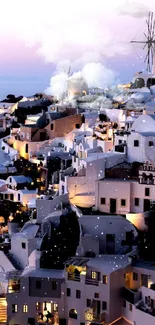 Santorini at dusk with pink and white hues, iconic windmills, and charming buildings.