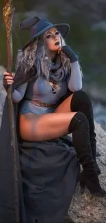 Mystical sorceress in gray outfit, posed in a fantasy setting for mobile wallpaper.