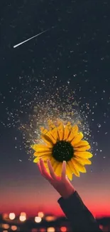 Hand holding a glowing sunflower with city lights in the background.