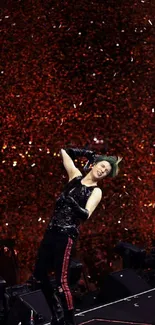 Energetic performer on stage with confetti backdrop in a lively concert setting.