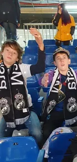 Football fans cheering energetically in a colorful stadium.