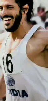 Runner in white jersey smiling during race action.