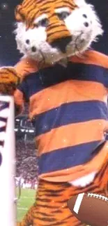 Tiger mascot in an Auburn stadium setting with football.