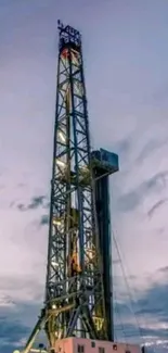 Split image of an oil rig and wind turbines under a blue sky.