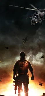 Silhouette of soldier with helicopters flying on a fiery battlefield.