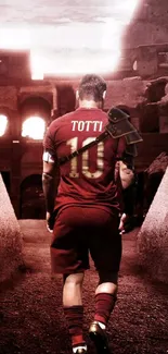 Footballer in a coliseum setting wearing a red jersey, walking into the light.