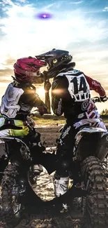 Two dirt bike riders enjoy an exhilarating sunset ride.