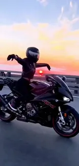 Motorcyclist rides into a stunning sunset on open road.