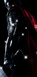 Thor in dramatic lighting with red cape background.