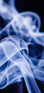 Ethereal blue smoke swirling in darkness.