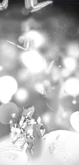 Ethereal wallpaper with butterflies and glowing bokeh lights in grayscale.