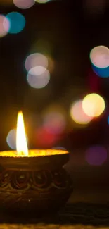 Candle glowing with colorful bokeh background