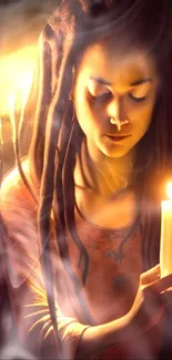 Woman with dreadlocks holding a candle.