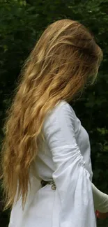 Woman in white dress with long hair, forest background.