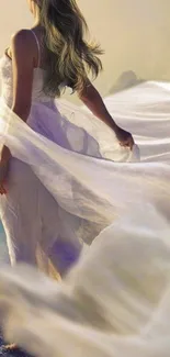 Ethereal lady in a flowing white dress stands on a scenic overlook.