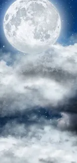 Full moon illuminating clouds against a deep blue night sky.