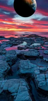 Planet above rocky ocean at sunset.