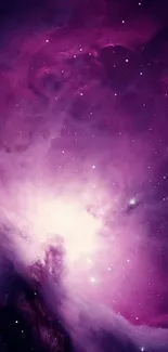 Purple galaxy wallpaper with stars and cosmic clouds.