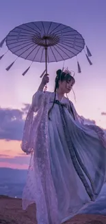 Person in traditional attire with parasol under a purple sunset sky.