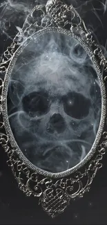 Skull in smoky ornate mirror on a dark background.