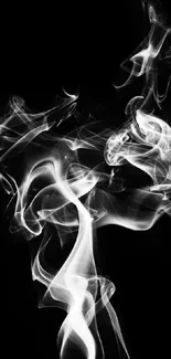 Ethereal smoke swirling on a black background, creating a mysterious abstract design.