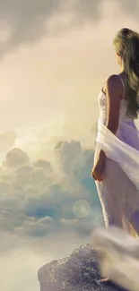 Woman in white dress standing in clouds.