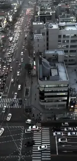 Aerial view of busy city streets at evening with traffic flow.