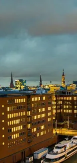 Evening cityscape with waterfront and illuminated buildings.